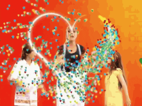 a woman is holding a heart shaped hoop surrounded by hearts