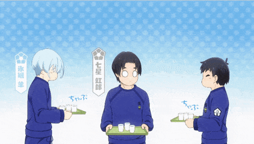 three boys are standing next to each other with one holding a tray