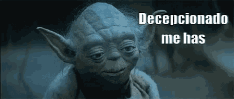 a close up of yoda from star wars making a funny face and saying `` decepcionado me has '' .