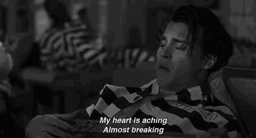 a black and white photo of a man in a striped shirt with the words `` my heart is aching almost breaking '' .