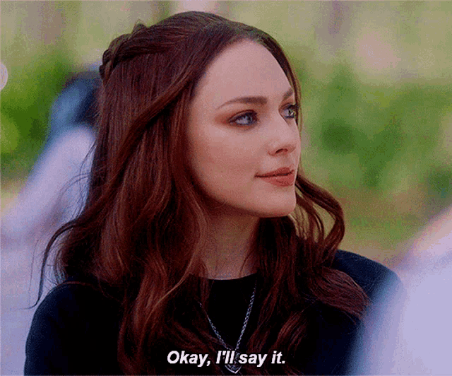 a woman with red hair says okay i 'll say it .