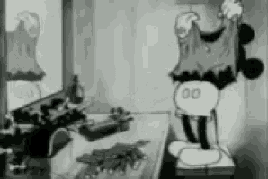 a black and white cartoon of mickey mouse is standing in front of a mirror