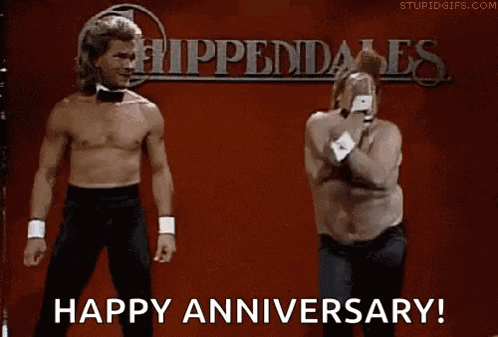 a couple of men are dancing in front of a sign that says happy anniversary .