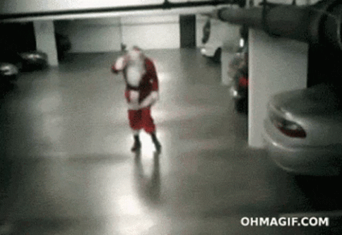 Drunk Santa Claus GIF - Drunk Santa Claus Fall Over GIFs