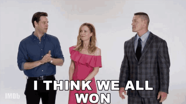 three people standing next to each other with the words i think we all won
