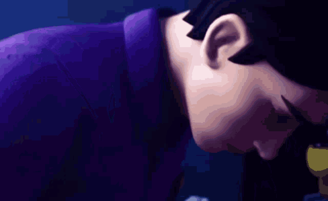 a close up of a cartoon character 's head with his eyes closed .