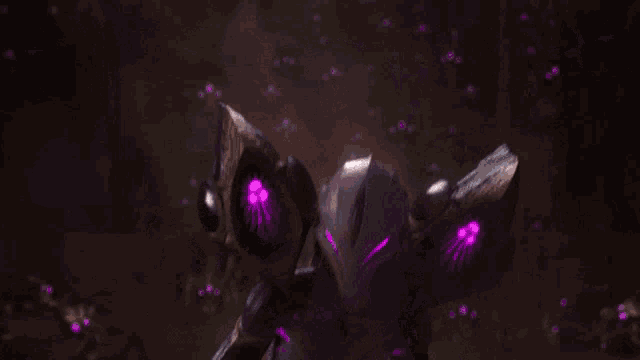a woman with purple eyes is wearing a black and purple outfit