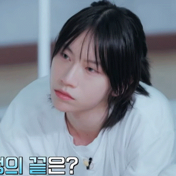 a close up of a person 's face with korean writing in the background