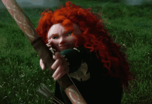 a cartoon character with red hair and blue eyes is holding a green object