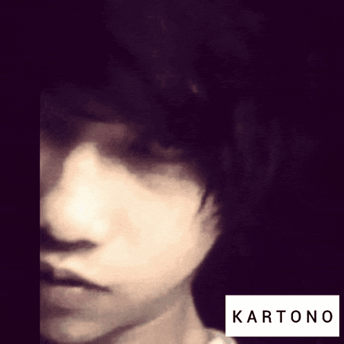 a close up of a person 's face with a label that says kartono on it