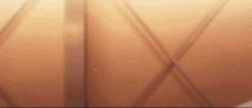 a close up of a basketball with a shadow on it