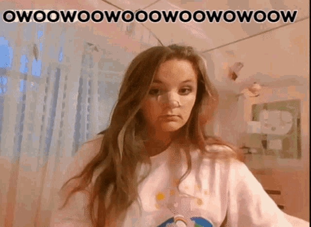 a girl with long hair is wearing a pink shirt that says owoowoowoowoowooow