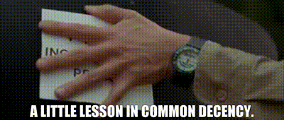 a person wearing a watch is holding a piece of paper with the words a little lesson in common decency written on it