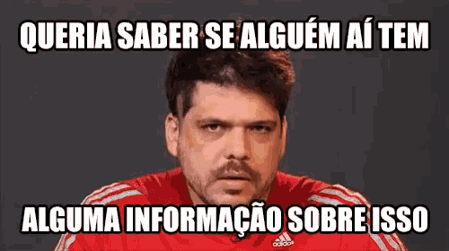 a man wearing a red adidas shirt is making a funny face