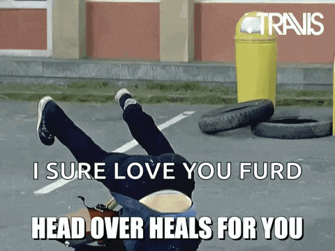 a person is laying on their back in a parking lot with the words i sure love you furd head over heals for you