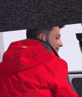 a man wearing a red jacket that says cpd on the back
