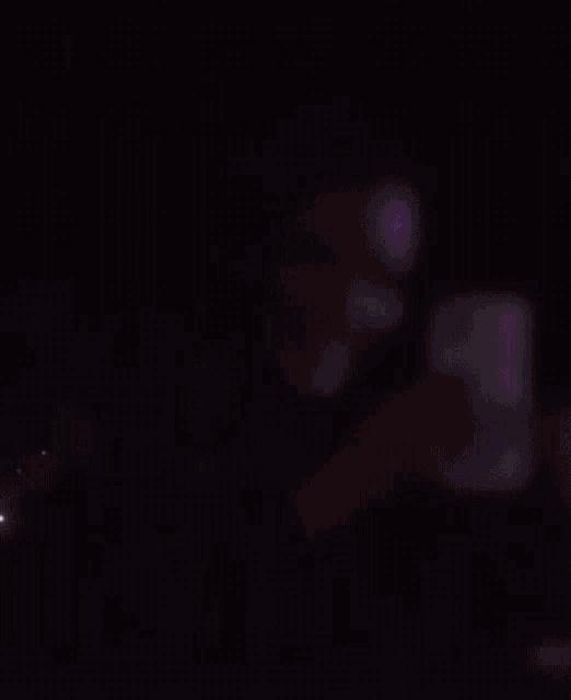 a person is standing in front of a large explosion