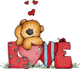 a teddy bear is sitting on a heart shaped love letter