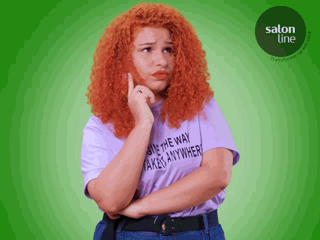 a woman with red hair is wearing a t-shirt that says " one way takes anywhere "