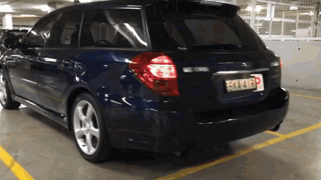 a blue car with a license plate that says fox416