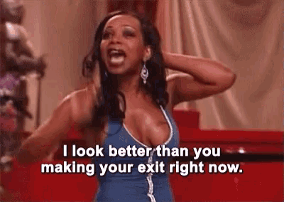 a woman in a blue dress is saying " i look better than you making your exit right now "