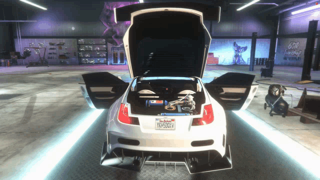 a white sports car with a california license plate that says ymh5d6v