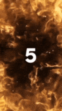 the number 5 is surrounded by flames on a dark background