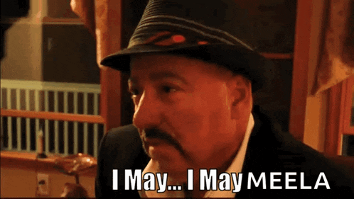 a man in a hat says " i may ... i may meela "