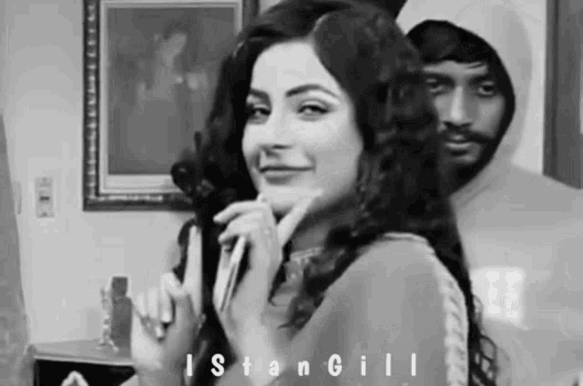 a black and white photo of a woman and a man with the name stangill on the bottom right