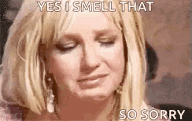 a woman is crying and saying `` yes i smell that so sorry '' with her eyes closed .