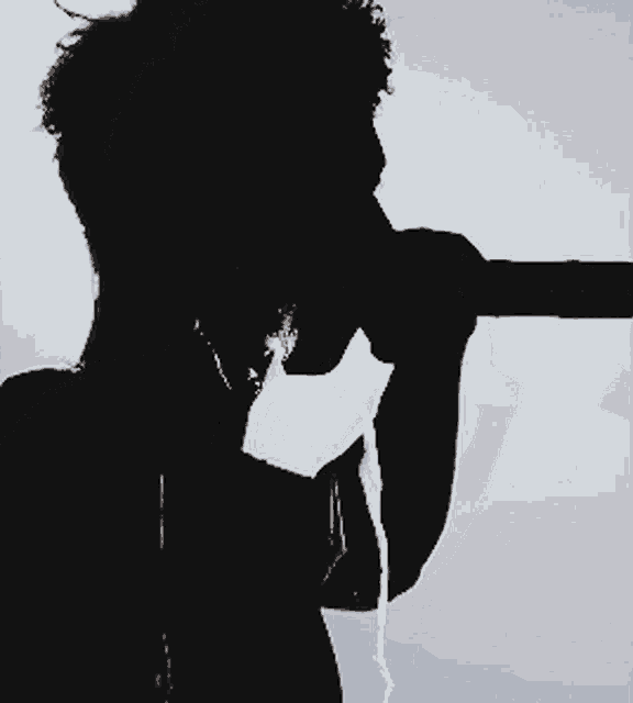 a silhouette of a man with a t-shirt that says ' i love you '