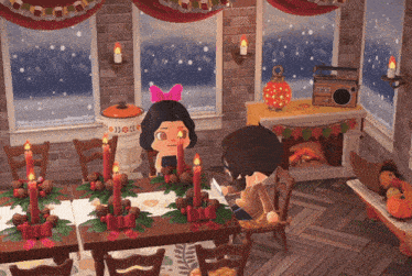 a girl with a pink bow sits at a table