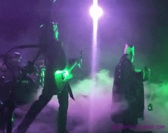 a man playing a guitar in front of a purple and green light that says " ghuletela.tumblr.com "