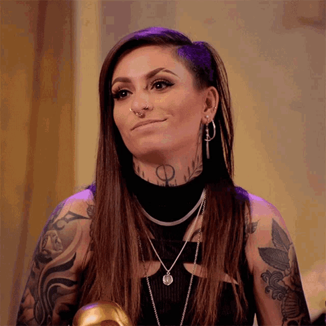a woman with a tattoo on her neck that says ' o '