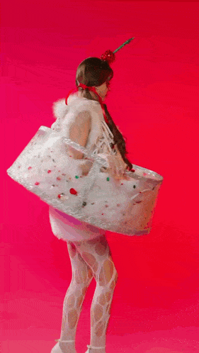 a woman in a costume that looks like a bowl of ice cream with a cherry on top