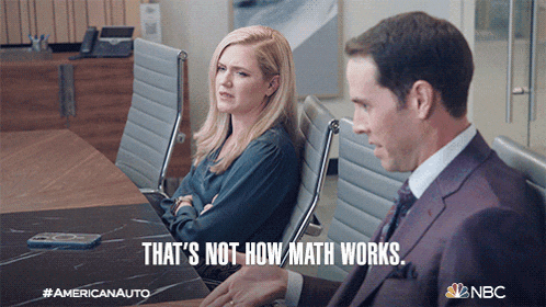 a man and a woman are sitting at a conference table and the woman says that 's not how math works