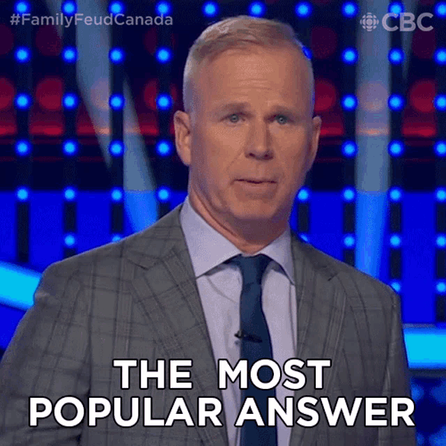 a man in a suit and tie says the most popular answer on a stage