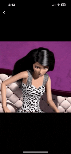 a barbie doll is sitting on a couch wearing a leopard print dress