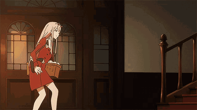 a girl in a red dress carrying a basket stands next to a shirtless man in a white shirt