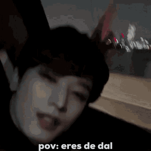 a close up of a person 's face with the words pov eres de dal above it