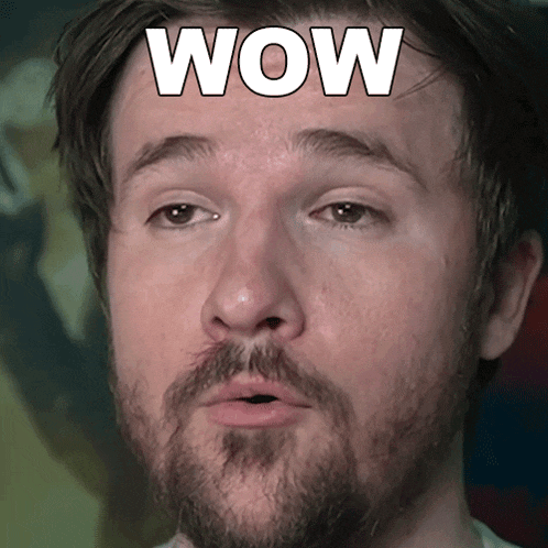 a close up of a man 's face with the word wow on it
