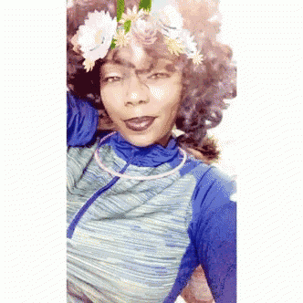 a woman wearing a flower crown on her head