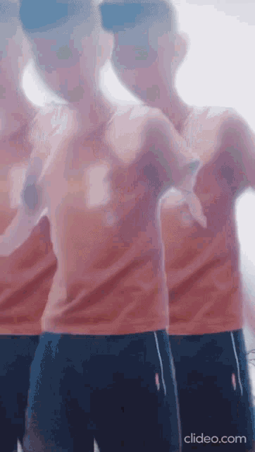 a blurred image of a person dancing with the website clideo.com visible in the corner