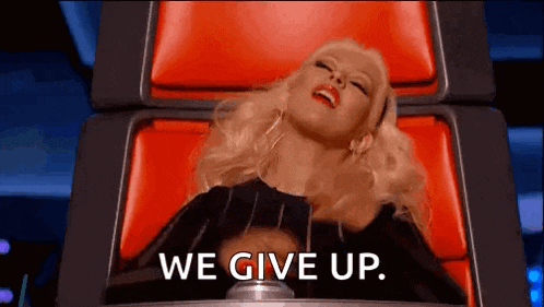 a woman is laying in a chair with the words `` we give up '' written on her face .
