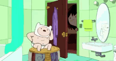 finn from adventure time is sitting on a stool in the bathroom