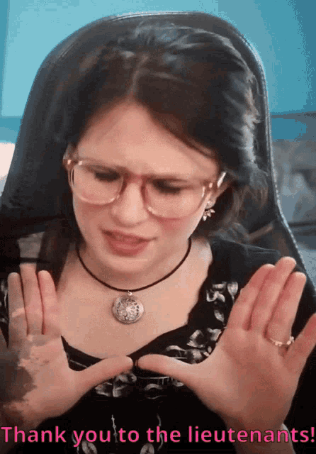 a woman wearing glasses and a necklace says " thank you to the lieutenants "