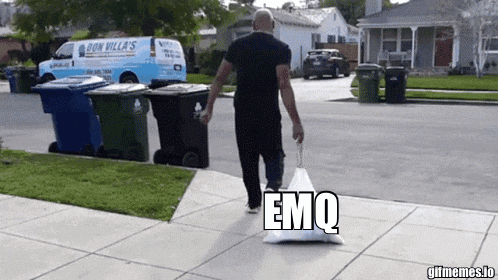 a man is carrying a bag that says emq