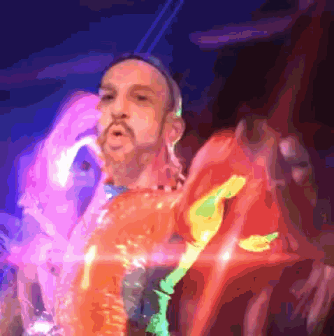 a painting of a man with a beard in a colorful shirt