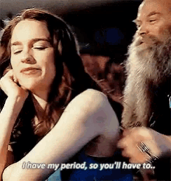 a man with a beard is talking to a woman who says i have my period so you 'll have to ..