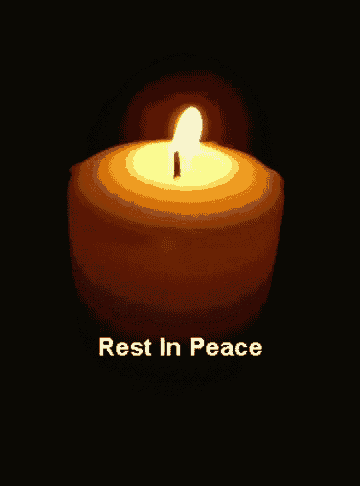 a candle is lit up in the dark with the words rest in peace below it